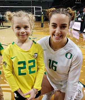 Bixby posing with UO volleyball player