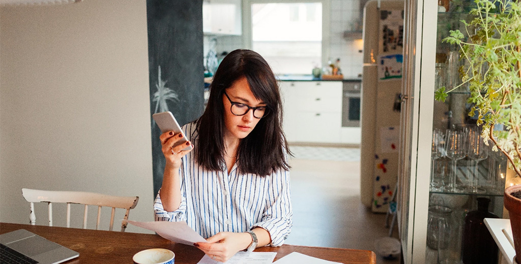 Woman working at kitchen tables