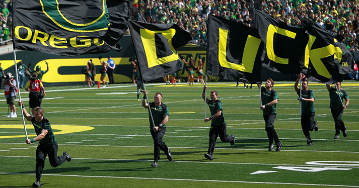 Chris Avery with UO cheerleading team
