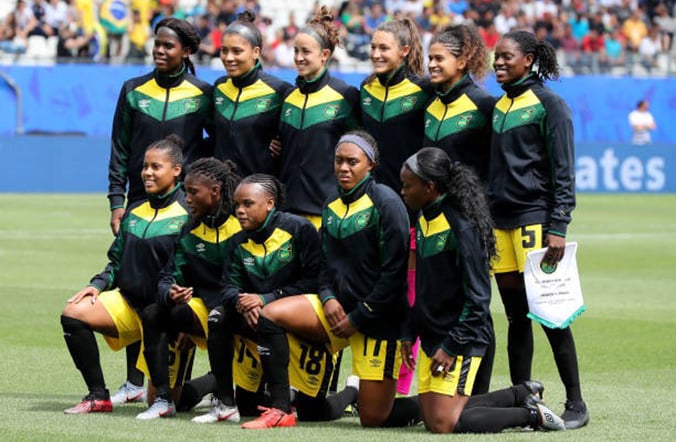 Reggae Girlz line up for a team photo before their World Cup match against Brazil