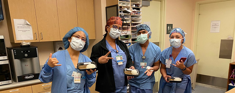 Healthcare workers with meals provided by the Motiv8 Foundation