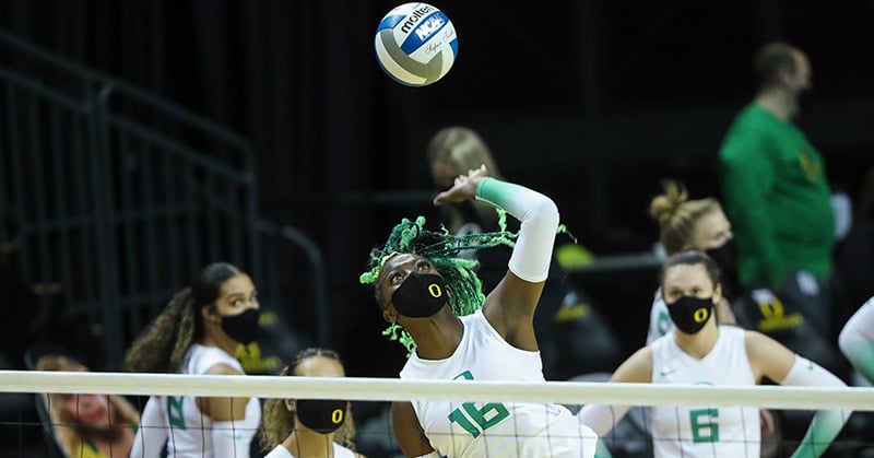 Gloria Mutiri spikes the ball during warmups