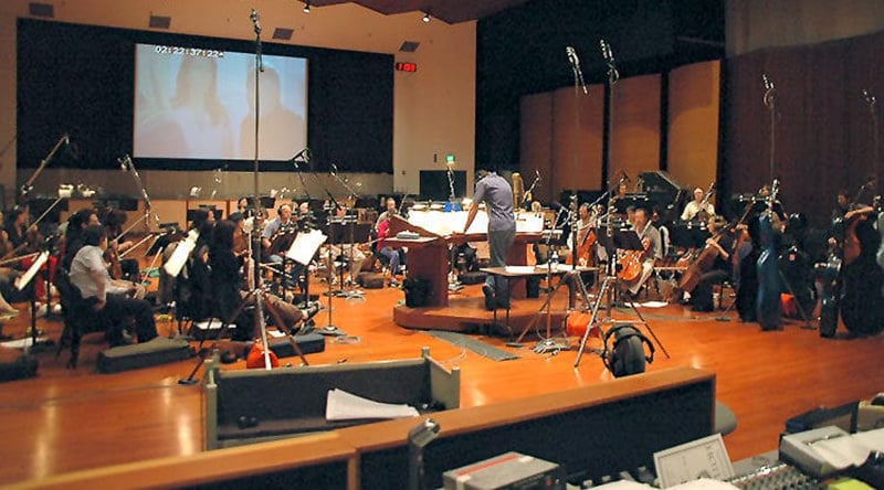 Chris Thomas conducting an orchestra at Warner Bros studios