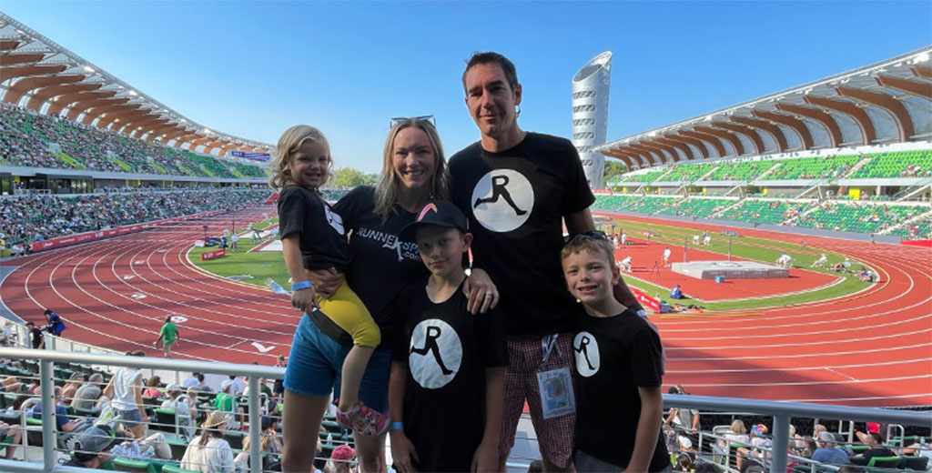 Ross, Kayla, and their children—Wynn, Myles, and Chace, at Hayward Field during the summer 2021 Olympic Trials