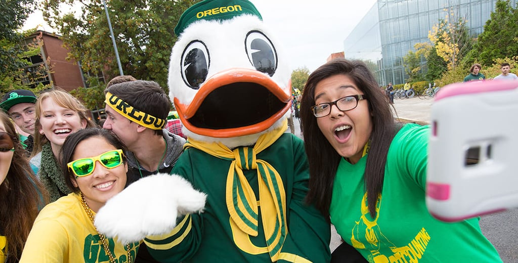 Students on campus pose with The Duck