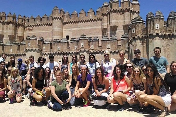 Ngo-Director with classmates in Spain, this time in front of some sort of castle