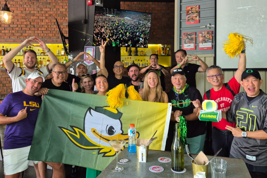 Photo of the Singapore Ducks chapter watch party after Oregon's win over Ohio State in the regular season