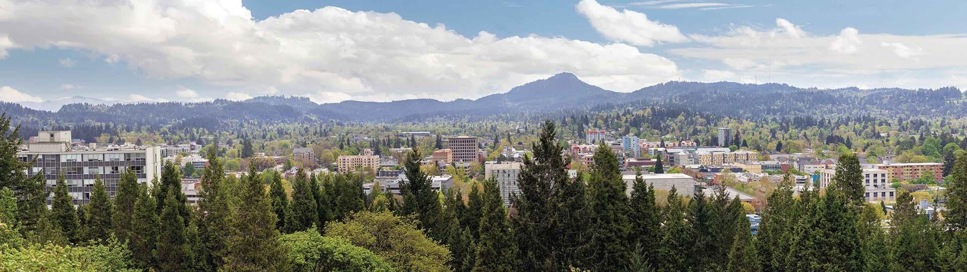 Line of trees with Eugene and UO campus in background
