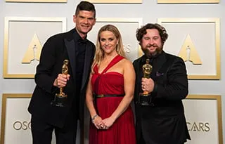 Will McCormick, Reese Witherspoon, Michael Govier at the 2021 Academy Awards