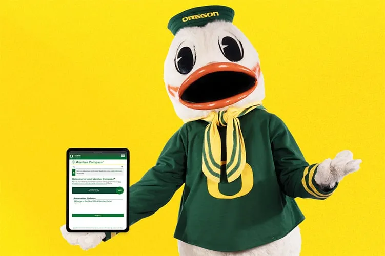 The Oregon Duck holding a tablet displaying the new member portal