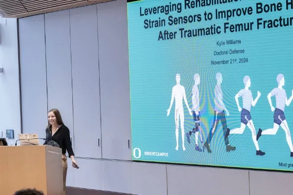 Williams at the podium for the introduction of her thesis defense