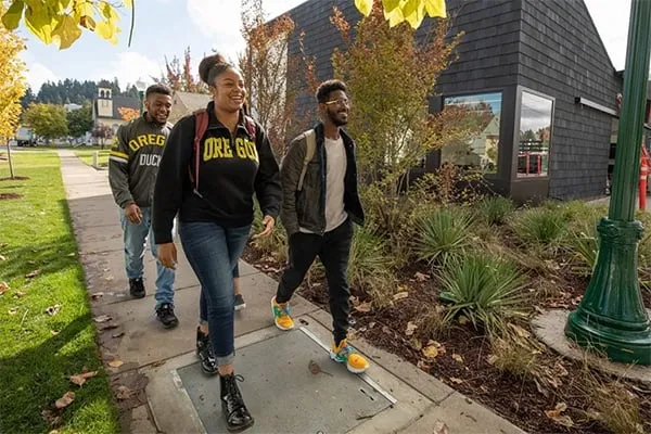 Students walking in front of the Lyllye Reynolds-Parker Black Cultural Center