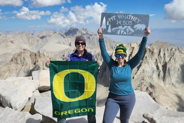 Maria and Emily show their Ducks pride atop Mt Whitney
