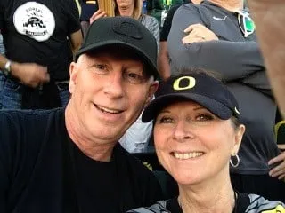 Pam with her husband David at a Ducks game