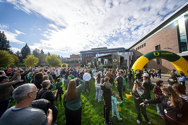 People gathering at the University of Oregon for Homecoming weekend.