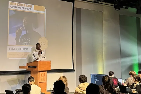Fedi Aniefuna delivering the opening speech at a presentation on January 18, 2025