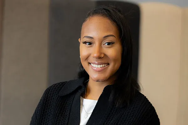 Headshot of Nia Pennington, a Black woman with straight long hair.