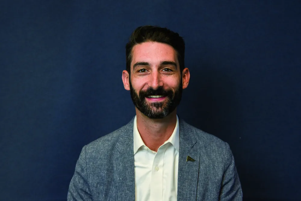 Headshot of Stephen Maher, a white man with dark hair and a beard.