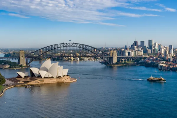 An aerial shot of the Sydney Opera House in Australia and the harbor area.