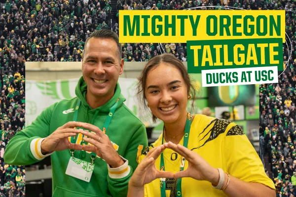 Mighty Oregon Tailgate Ducks at USC text next to an image of a father and daughter in Oregon Ducks gear making Os with their hands.