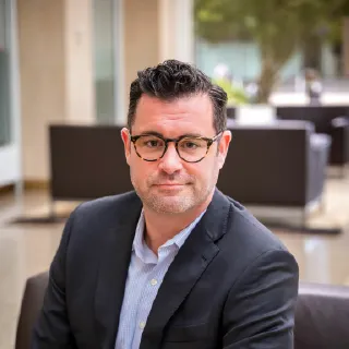A headshot of Matthew Schroettnig, a law school board member