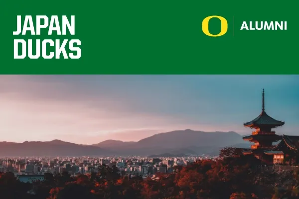 Japan Ducks header on a green banner above a photo of Tokyo with mountains in the background with a pink and blue sky.