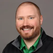 A headshot of Sam Woodell