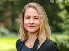 A headshot of Whitney Phillips, a white woman with blonde hair. 