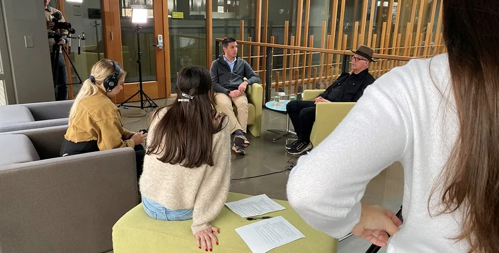 Group of University of Oregon students filming an interview