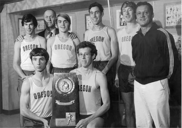 Members of the 1971 Oregon men's cross-country team with their NCAA trophy