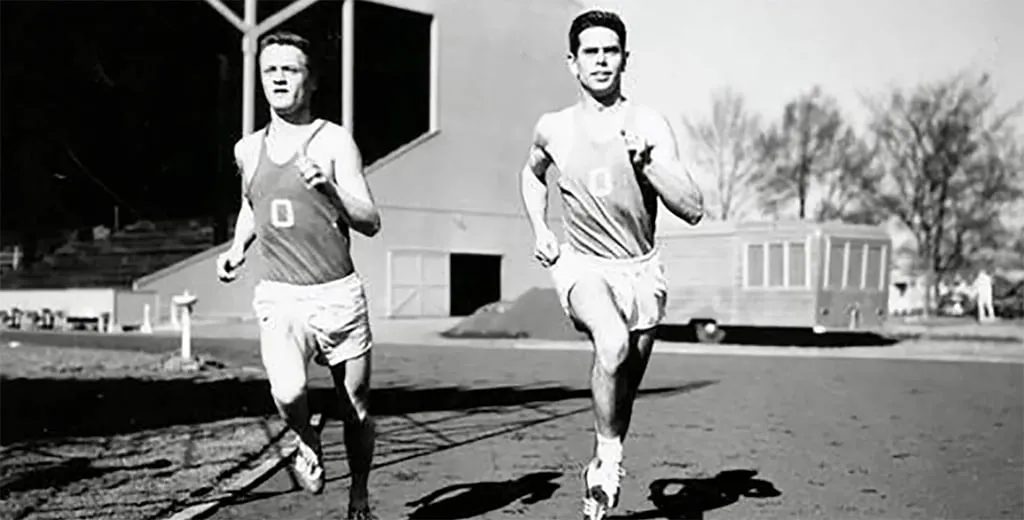 Bill Dellinger runs with Jim Bailey