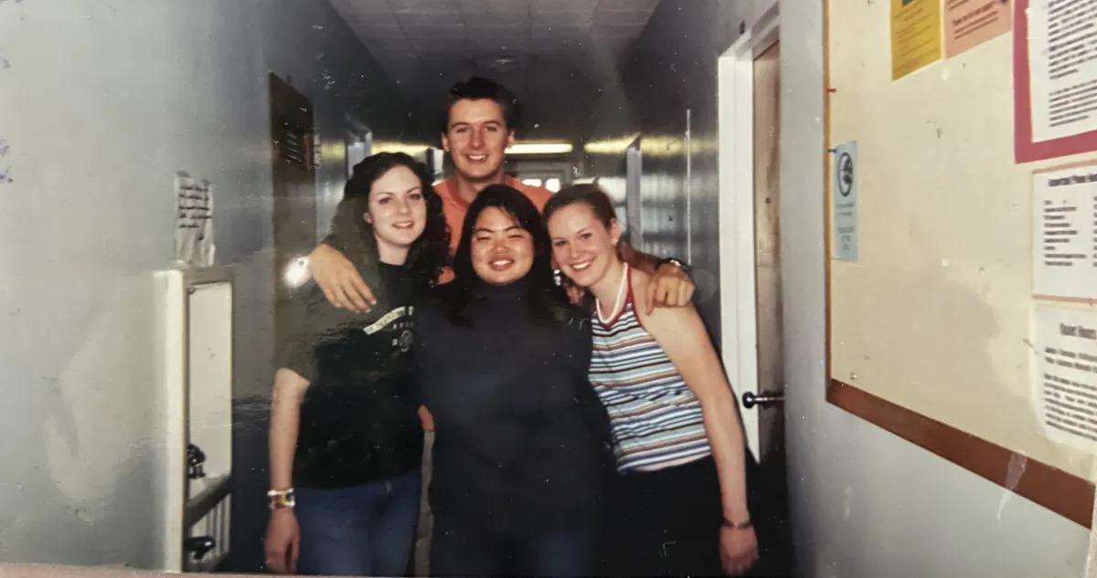 Four classmates in Hamilton Hall.