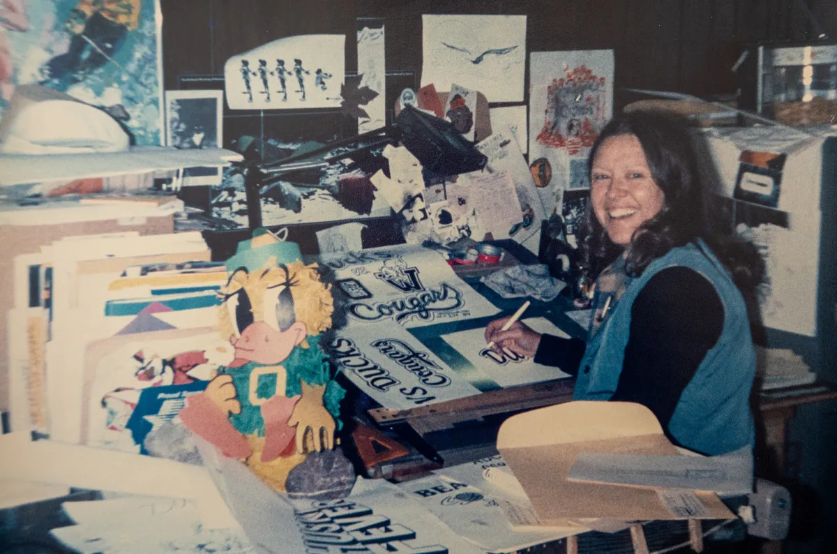 Clau Lundgren works on a sketch in the studio at Oh SHIRT!