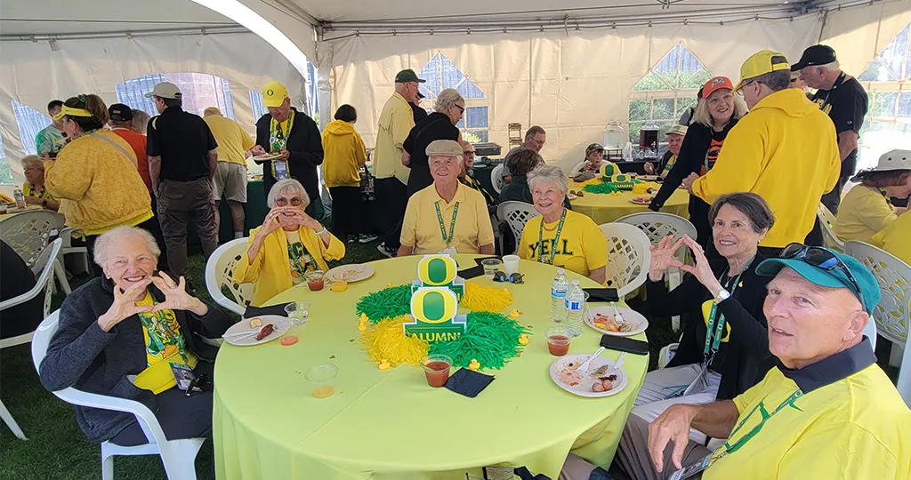 50th and 60th Reunion attendees pose at their tailgate in September 2025