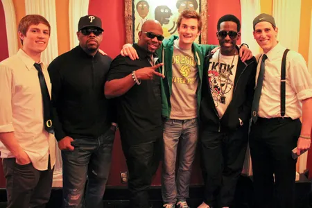 Three members of On the Rocks pose with the members of Boyz II Men.