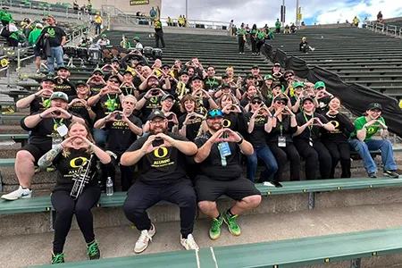 The Oregon Alumni Band sits in the stands at Autzen Stadium